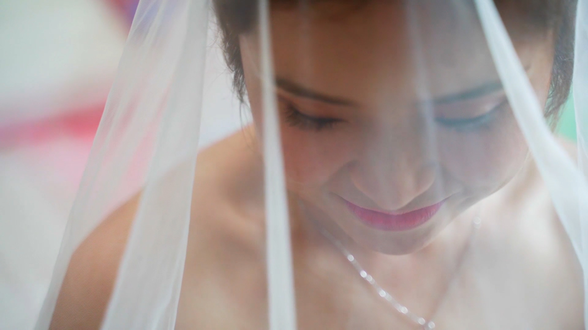 Wedding videography in Singapore bride getting veiled by parents
